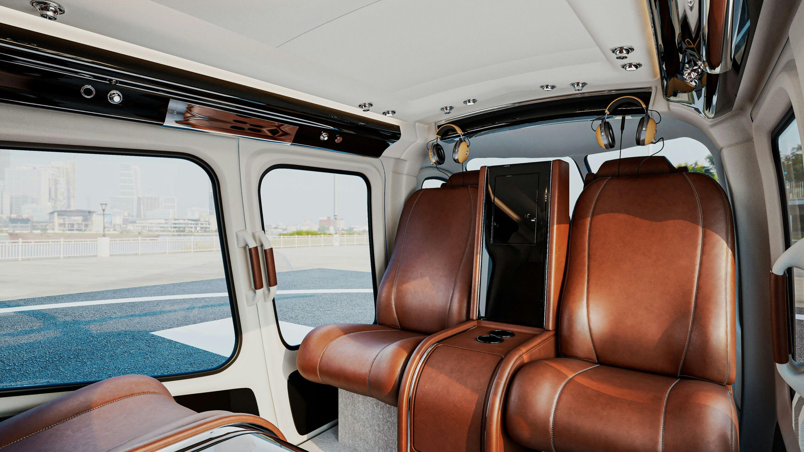 Interior view of a luxurious private helicopter with brown leather seats and a cityscape view.